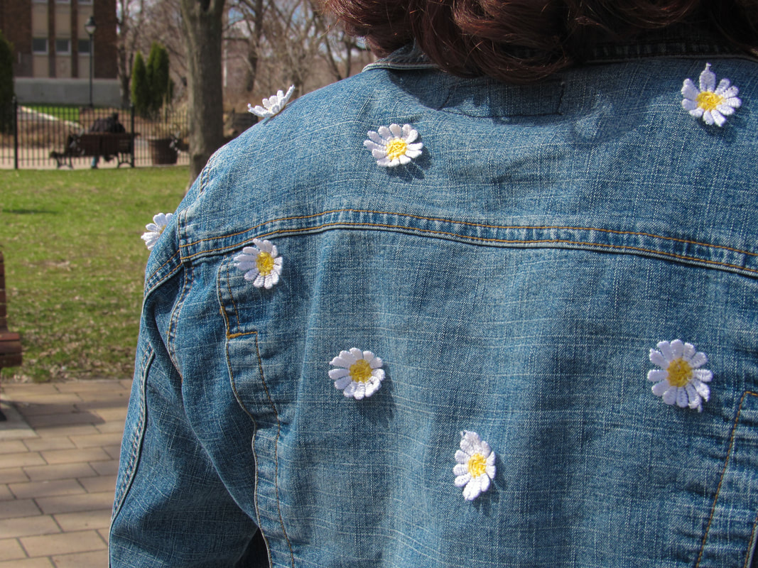 Closeup of the back of the jacket on the left shoulder.